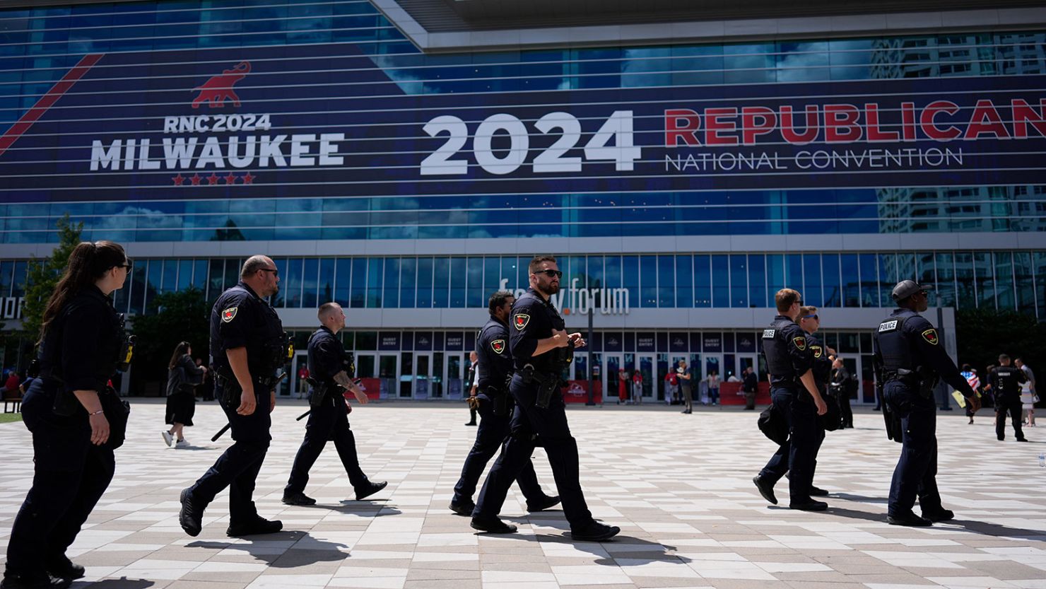 Law enforcement officers walk around the Fiserv Forum before the Republican National Convention Wednesday in Milwaukee.