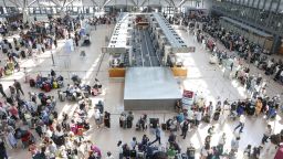 Travelers wait in Terminal 1 for check-in at Hamburg Airport, in Hamburg, Germany, Friday July 19, 2024. A widespread Microsoft outage disrupted flights, banks, media outlets and companies around the world on Friday.