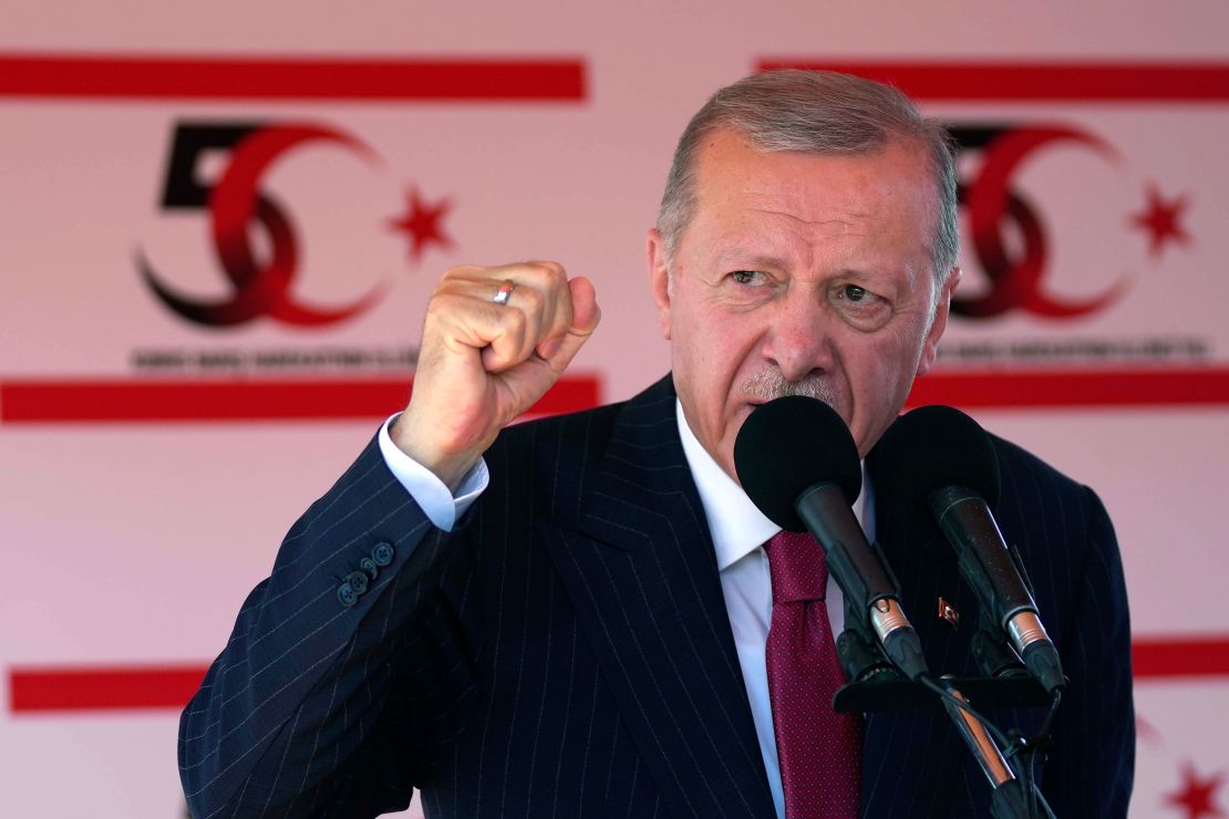 Turkish President Recep Tayyip Erdogan talks during a military parade in the Turkish-occupied area of Nicosia on Saturday.