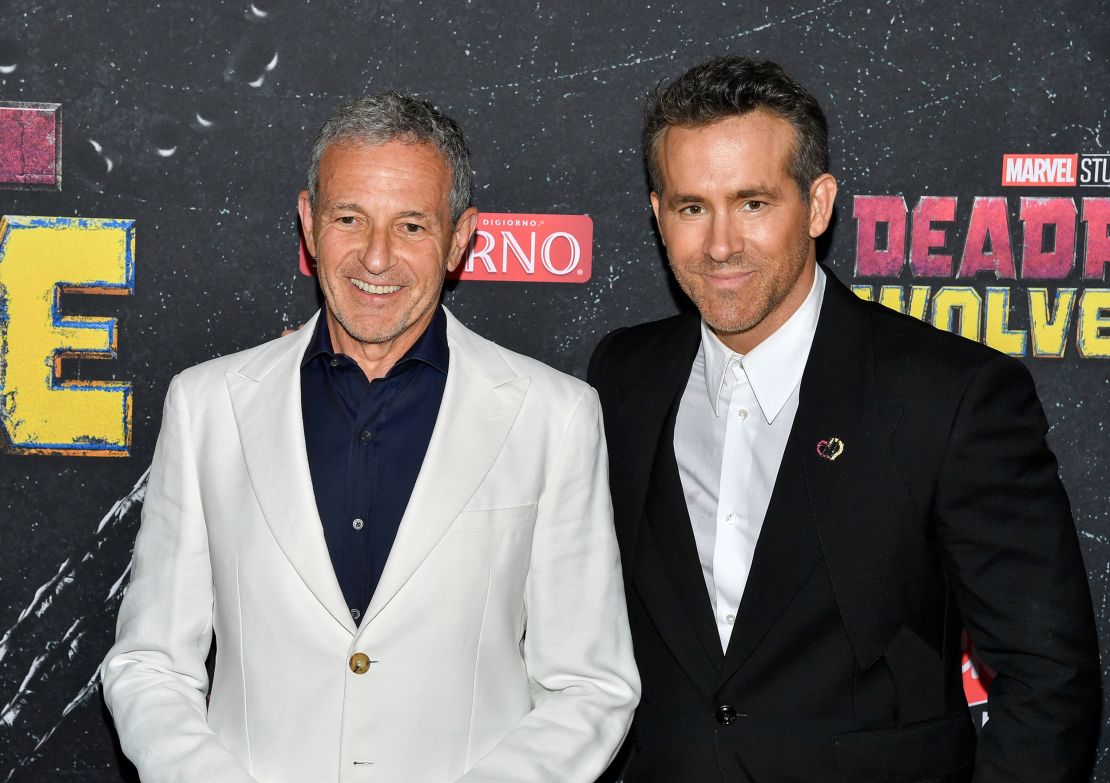 Robert Iger, left, and Ryan Reynolds attend the world premiere of Marvel Studios' 