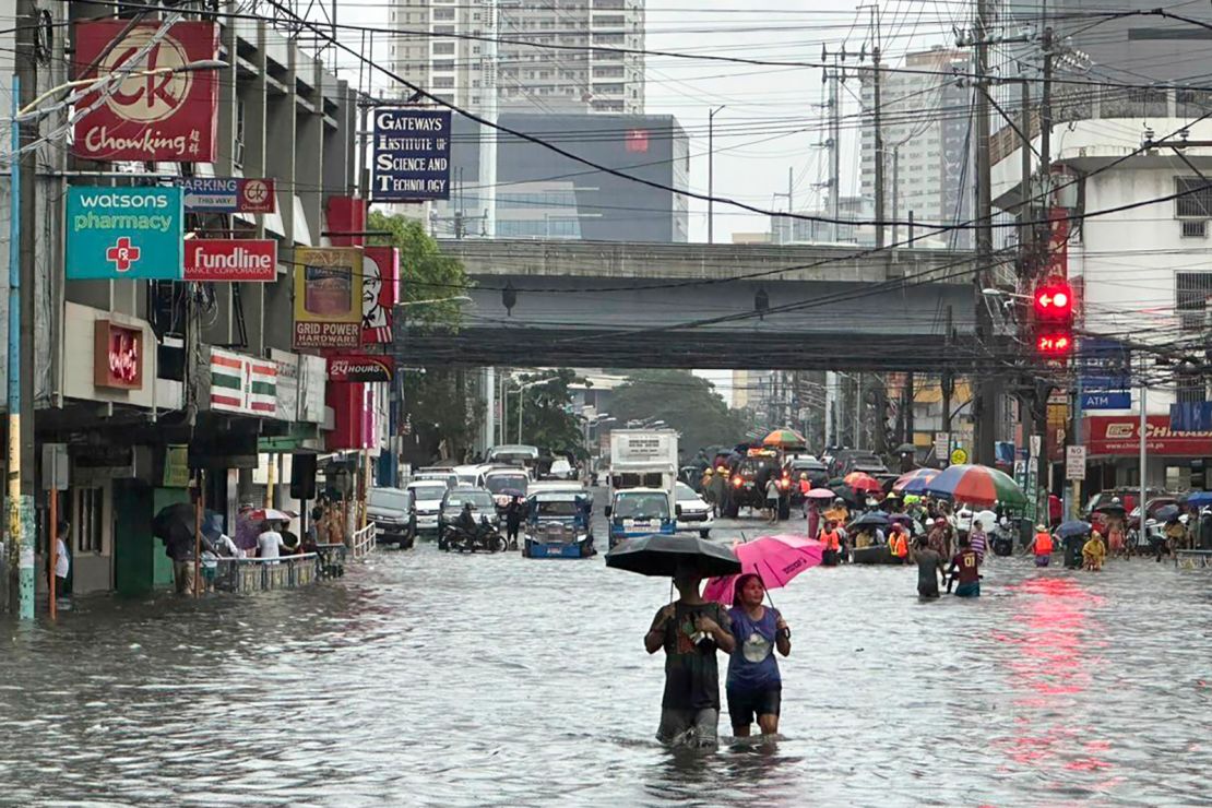 Streets flood from monsoon rains worsened by offshore typhoon Gaemi on Wednesday, July 24, 2024, in Manila, Philippines.