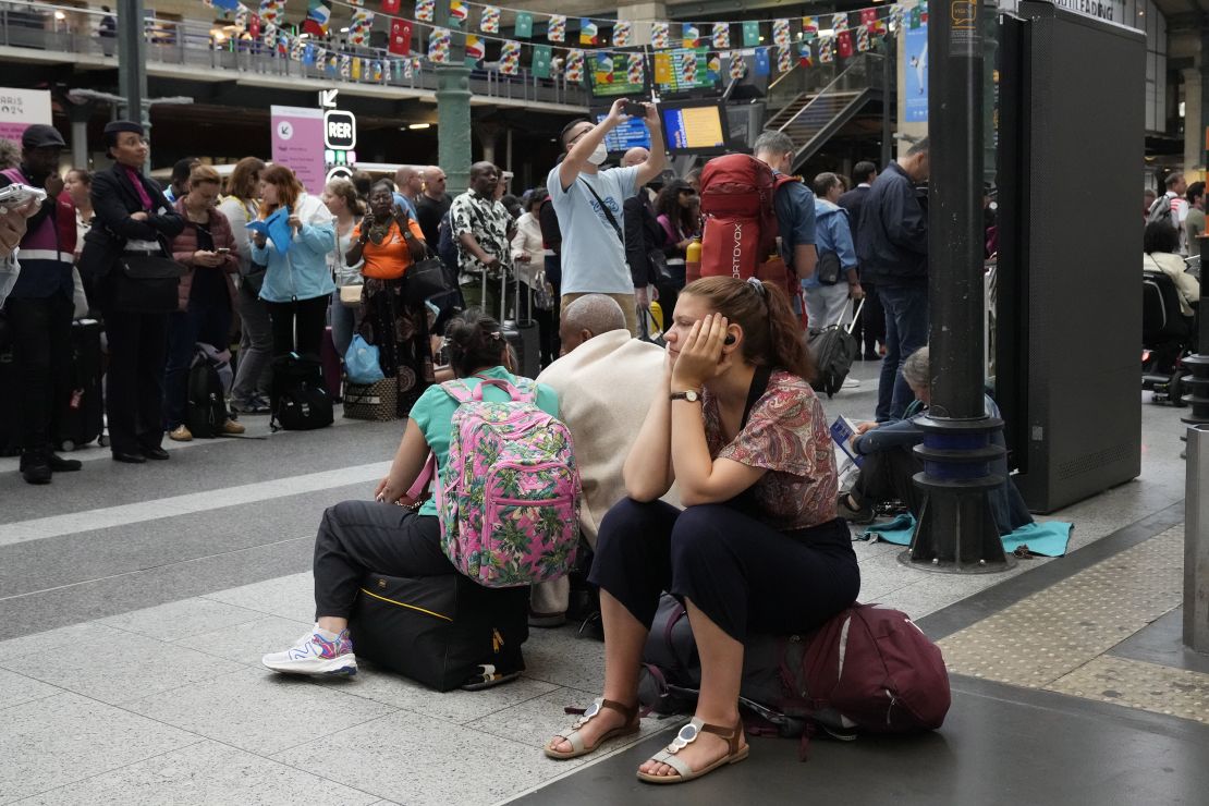 A traveler waits inside the Gare du Nord train station in Paris on July 26.