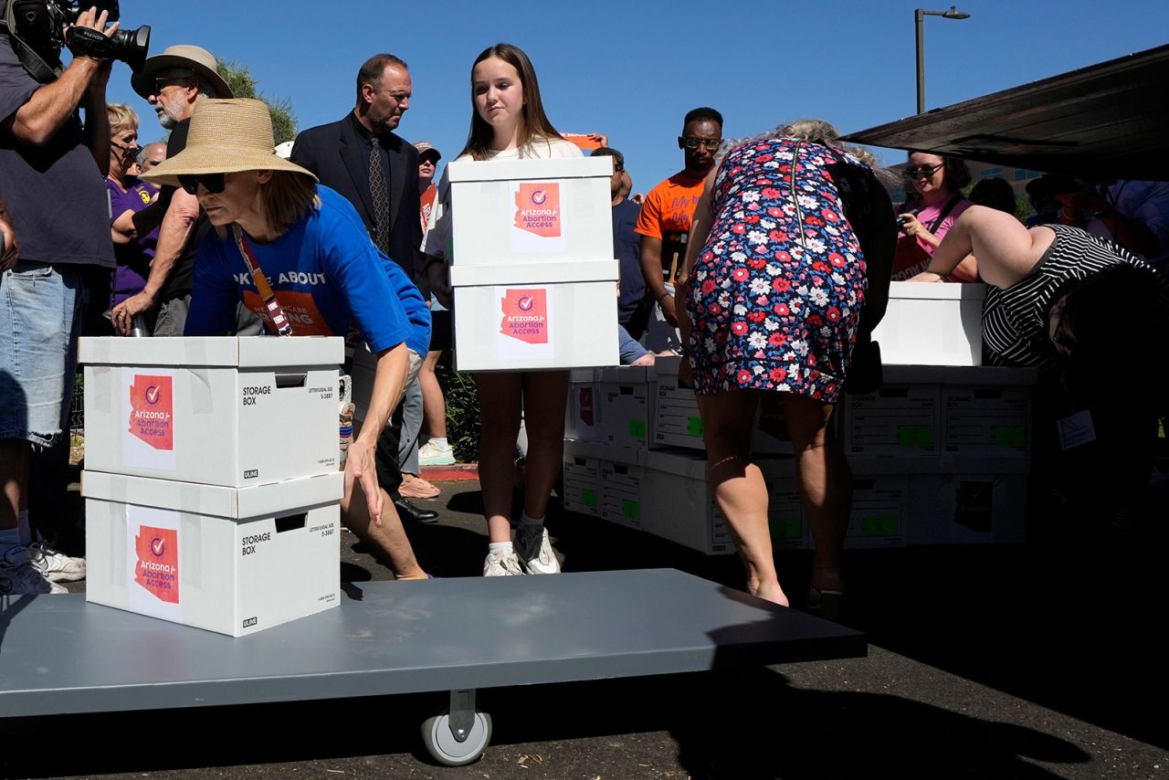 Abortion-rights supporters deliver petition signatures to the capitol to get an abortion rights ballot measure on the November general election ballot, on July 3, 2024, in Phoenix, Arizona.