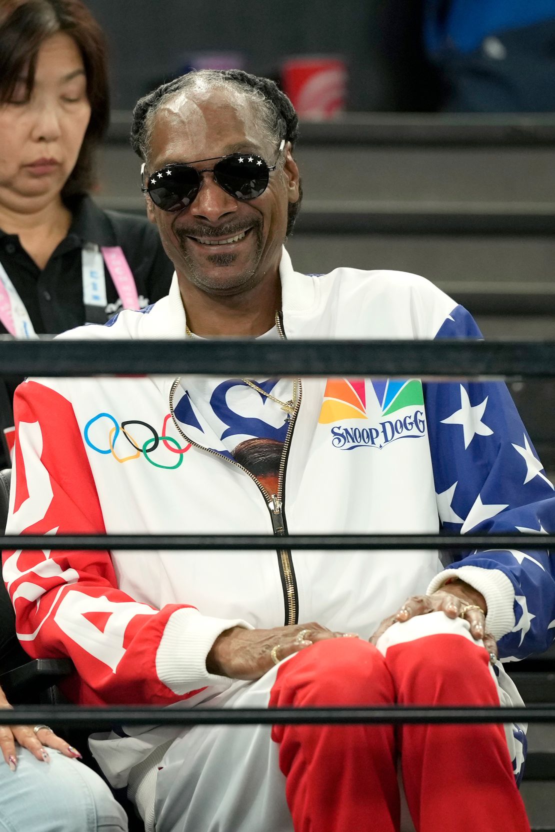 Snoop Dogg was seen at the women's artistic gymnastics qualification round wearing a personalized NBC Olympics sports jacket.