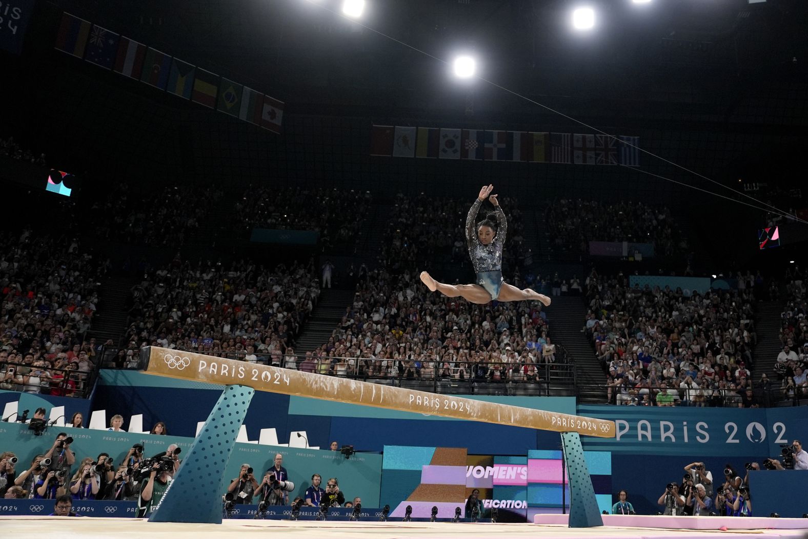 US gymnast Simone Biles competes on the balance beam during the Olympic qualification round on July 28. <a >She landed awkwardly</a> while warming up for her floor routine, but <a >she fought through the pain</a> to post an impressive all-around score.