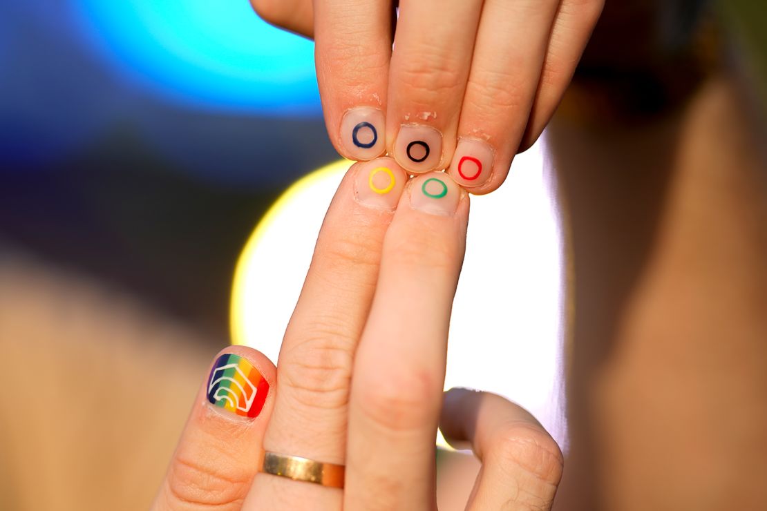 Jeremy Goupille, co-chair of the?Pride House?at the Paris Olympics, shows his nails painted with the rainbow colors on July 29, 2024.