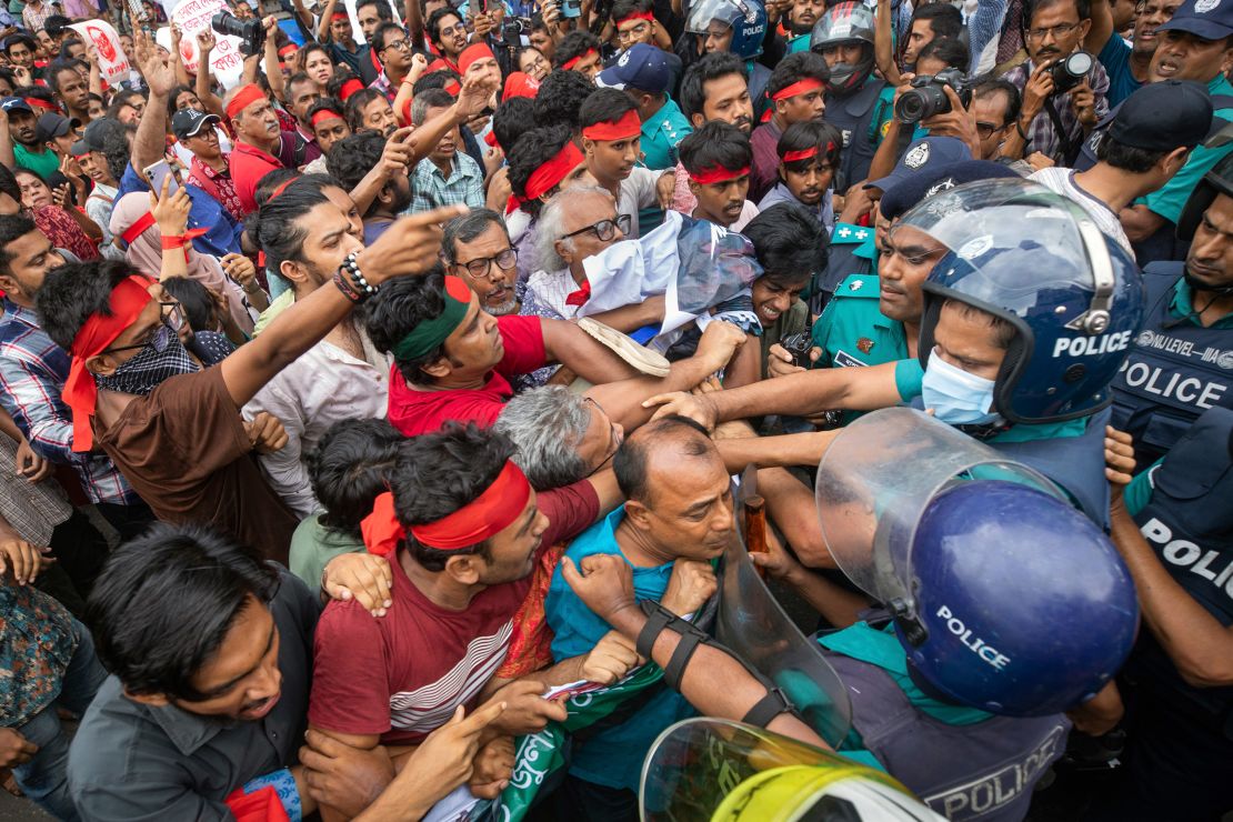 Activists grapple with police in Dhaka, Bangladesh, on July 30, as they stage a march for the victims of nationwide protests. At least 32 children were killed in the rallies last month, UNICEF said.