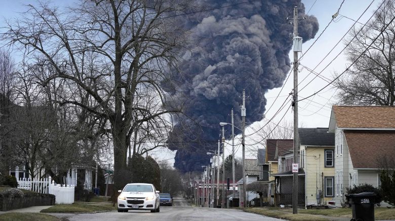 FILE - A black plume rises over East Palestine, Ohio, as a result of a controlled detonation of a portion of the derailed Norfolk Southern trains Feb. 6, 2023. People who live near East Palestine, Ohio, can now get $25,000 apiece for any injuries they sustained after last year's Norfolk Southern freight train derailment on top of whatever money they get for property damage as part of the $600 million class-action settlement. (AP Photo/Gene J. Puskar, File)