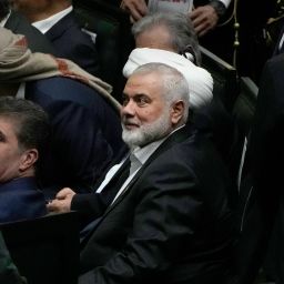 Hamas chief Ismail Haniyeh, center, sits prior to the start of the swearing-in ceremony of newly-elected Iranian President Masoud Pezeshkian at the Iranian parliament, in Tehran, Iran, Tuesday, July 30, 2024.