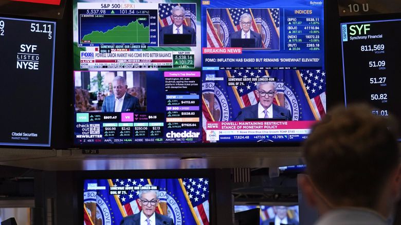 A bank of television screens on the floor of the New York Stock Exchange shows Federal Reserve Chair Jerome Powell on July 31.