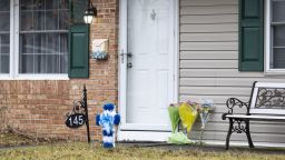 FILE - Flowers rest at the front door of the Mohn residence in Upper Orchard section of Levittown, Pa., Feb. 2, 2024. Justin Mohn, the man accused of beheading his father in their suburban Philadelphia home early this year and posting a video of the severed head online, is competent to stand trial, a judge ruled Thursday, Aug. 1. (Tyger Williams/The Philadelphia Inquirer via AP, File)