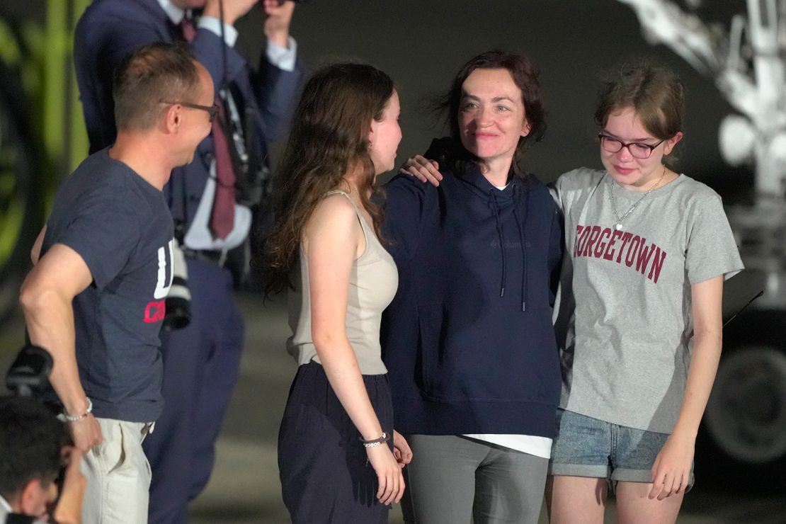 Alsu Kurmasheva, second from the right, is greeted by family members from l-r., Pavel Butorin, Bibi Butorin, and Miriam Butorin on the tarmac at Andrews Air Force Base, Maryland.