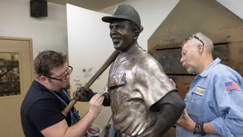 Nate Ford, left, and Jeff Herndon apply finishing touches July 24 to a statue of baseball Hall of Famer and civil rights pioneer Jackie Robinson in Loveland, Colorado.
