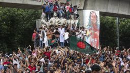 Protesters mount a public monument in Dhaka, Bangladesh, on August 5, after celebrating Prime Minister Sheikh Hasina's resignation amid weeks of nationwide rallies over quotas for government jobs.