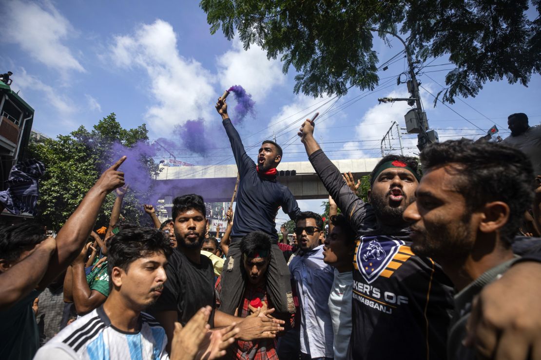 Protesters shout slogans in the Bangladeshi capital of Dhaka on Monday. One demonstrator in the capital had told CNN that police used tear gas to disperse the crowds.