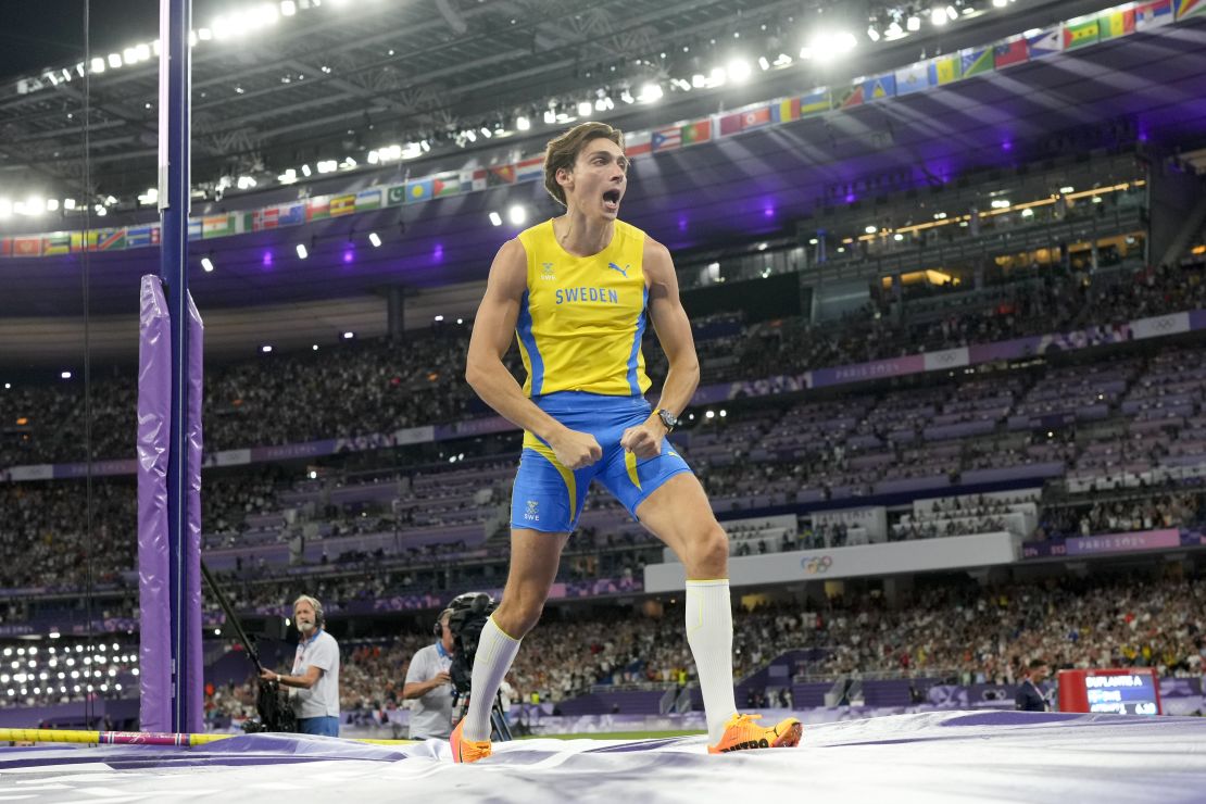 Duplantis celebrates winning his second Olympic gold medal.