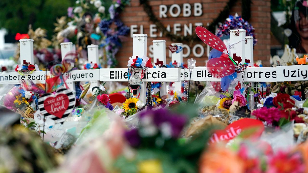 Flowers and other items surround crosses at a memorial for the victims of the shooting at Robb Elementary School in Uvalde, Texas, on June 9, 2022.