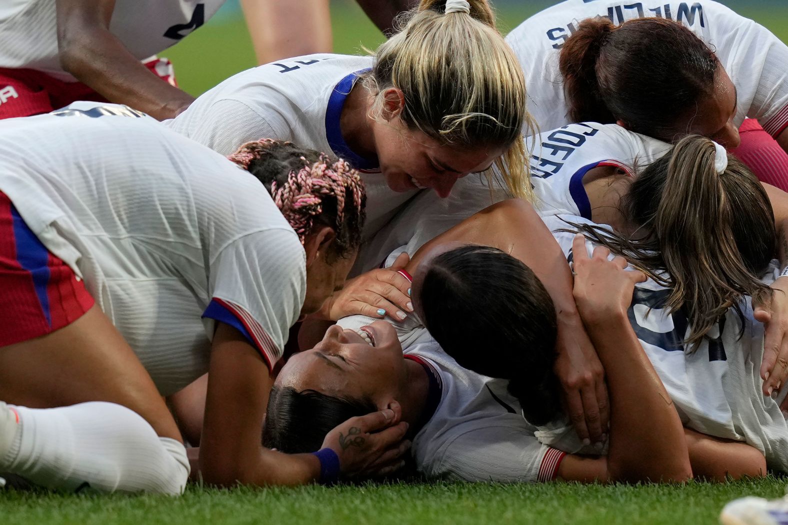 US soccer player Sophia Smith is mobbed by teammates after scoring an extra-time goal against Germany on Tuesday, August 6. The Americans won 1-0 <a >to advance to the gold-medal match</a>.