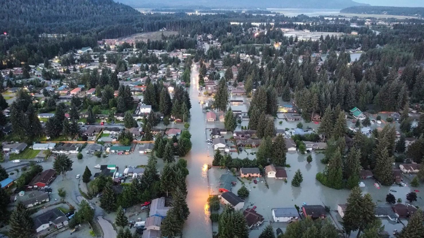 High water around homes and neighborhoods following an outburst of flooding from a lake dammed by the Mendenhall Glacier on Tuesday in Juneau, Alaska.