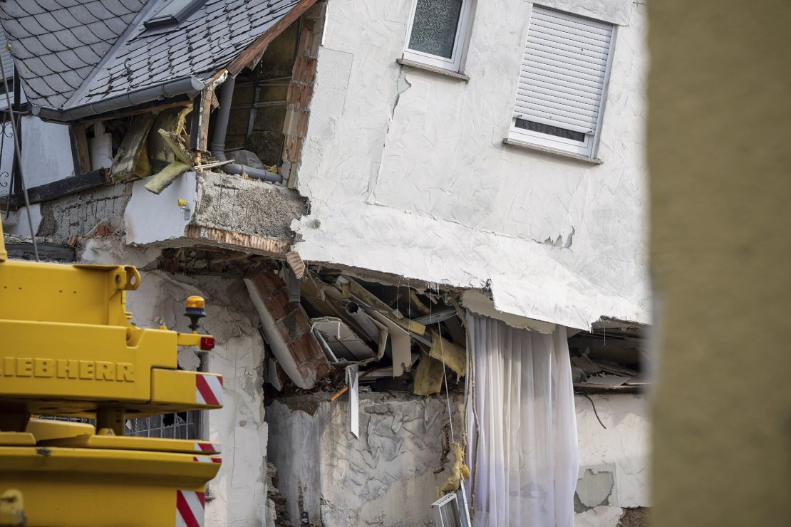 A badly damaged wall at a partially collapsed hotel.