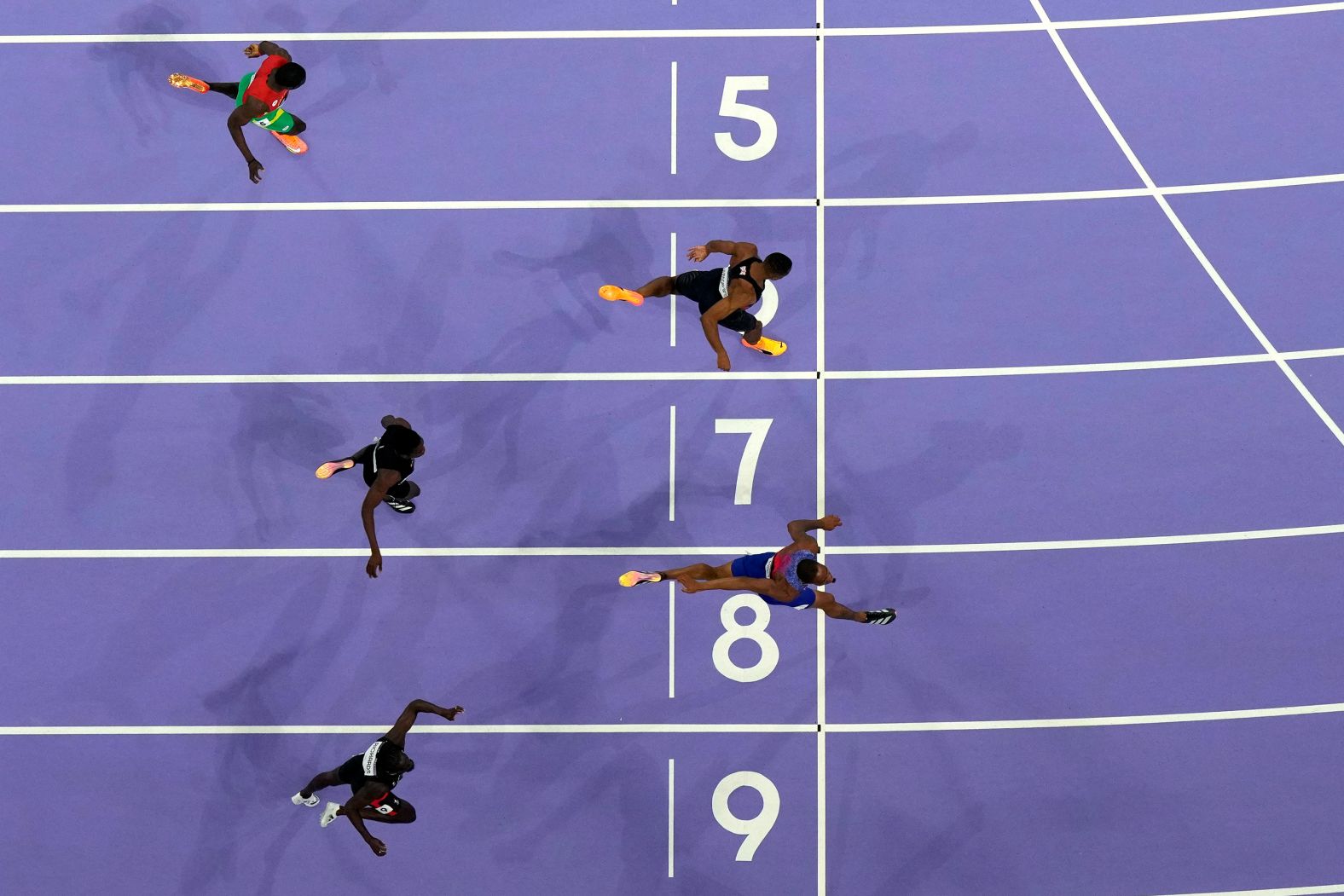 The United States' Quincy Hall reaches for the finish line <a >to win the 400-meter final</a> on Wednesday, August 7. He passed several runners down the straightaway to complete an epic comeback.