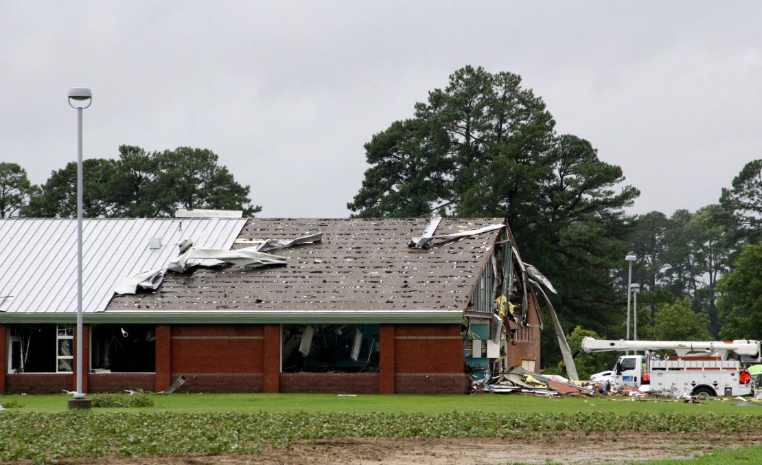 Parts of Springfield Middle School lay on the ground after being ripped off by a tornado, spawned by Debby, in Lucama, North Carolina, Thursday.