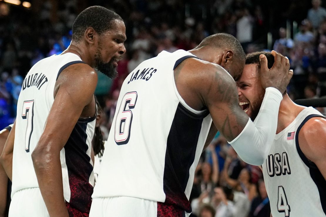 Stephen Curry celebrates with Team USA teammates Lebron James and Kevin Durant, after beating Serbia at the 2024 Summer Olympics in Paris, on August 8, 2024.