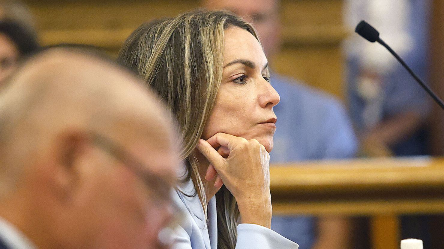 Karen Read listens to arguments from lawyers in court in Dedham, Mass., on Friday, Aug. 9, 2024.