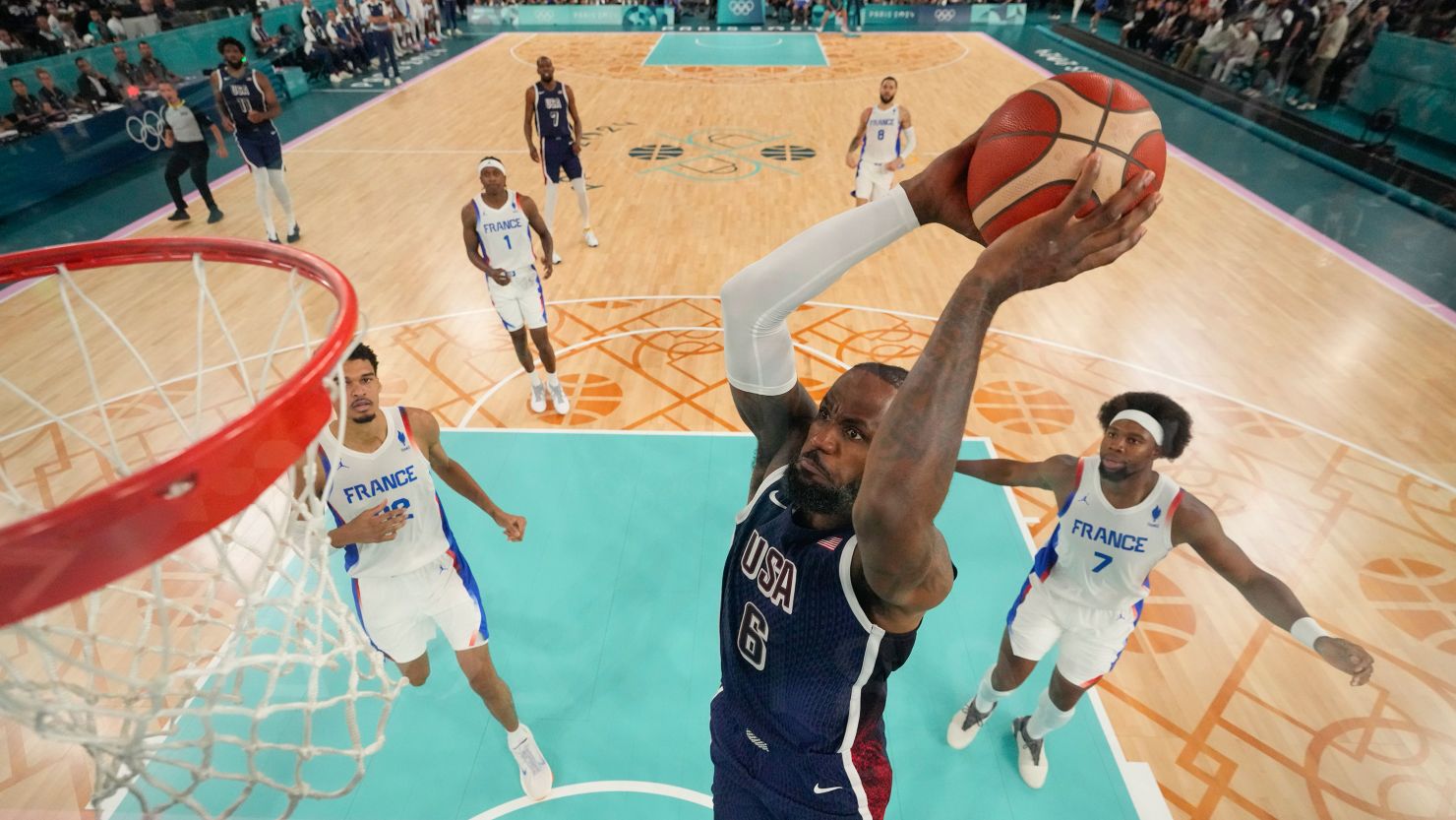 United States' LeBron James (6) dunks during a men's gold medal basketball game at Bercy Arena at the 2024 Summer Olympics, Saturday, Aug. 10, 2024, in Paris, France. (AP Photo/Mark J. Terrill, Pool)