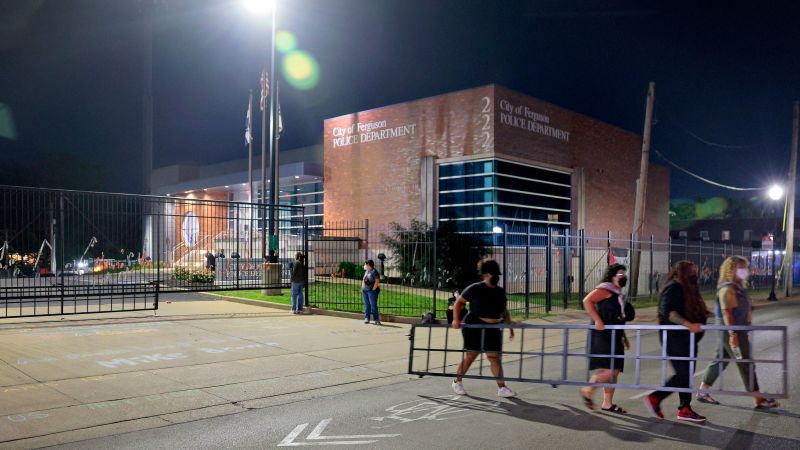 Attack on Ferguson police officers, arrests at Michael Brown protest