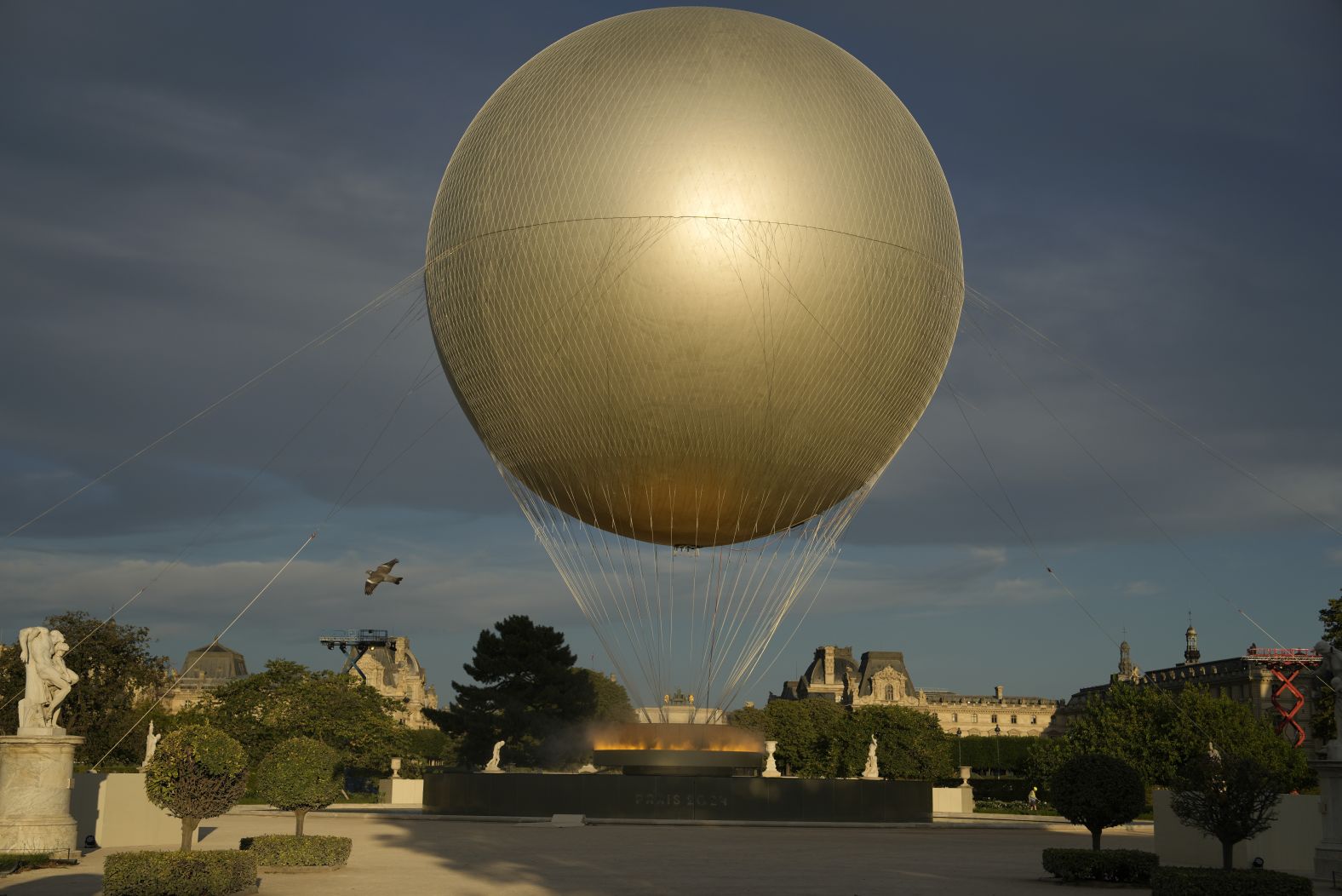 The Olympic cauldron sits in the Tuileries Garden.