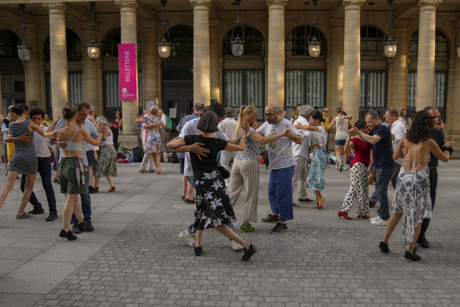 Couples dance in Paris ahead of the ceremony.