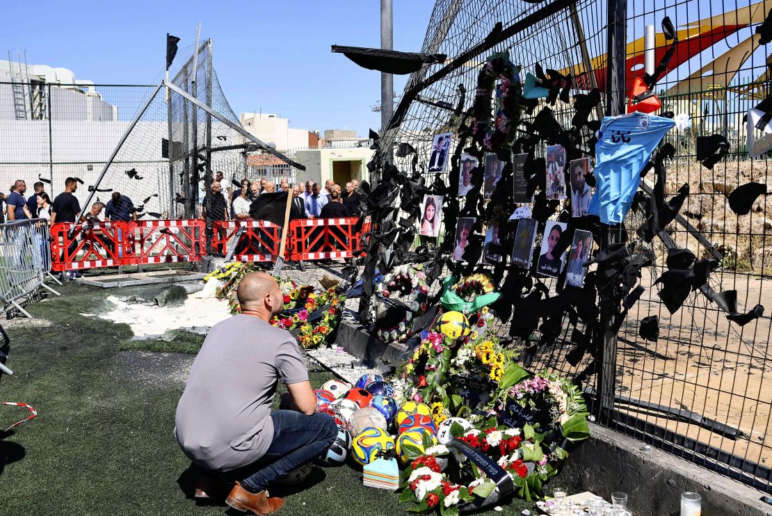 Flowers, balls and other items are left in a tribute to victims killed by a rocket in Majdal Shams in the Israeli-occupied Golan Heights on July 30.