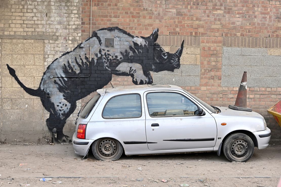 A rhino by Banksy appears on a wall in Charlton, in southeast London, on August 12, 2024.