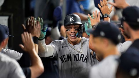 New York Yankees designated hitter Aaron Judge celebrates after hitting his 300th career home run, the fastest player to do so in MLB history, during a baseball game against the Chicago White Sox, on August 14, 2024, in Chicago.