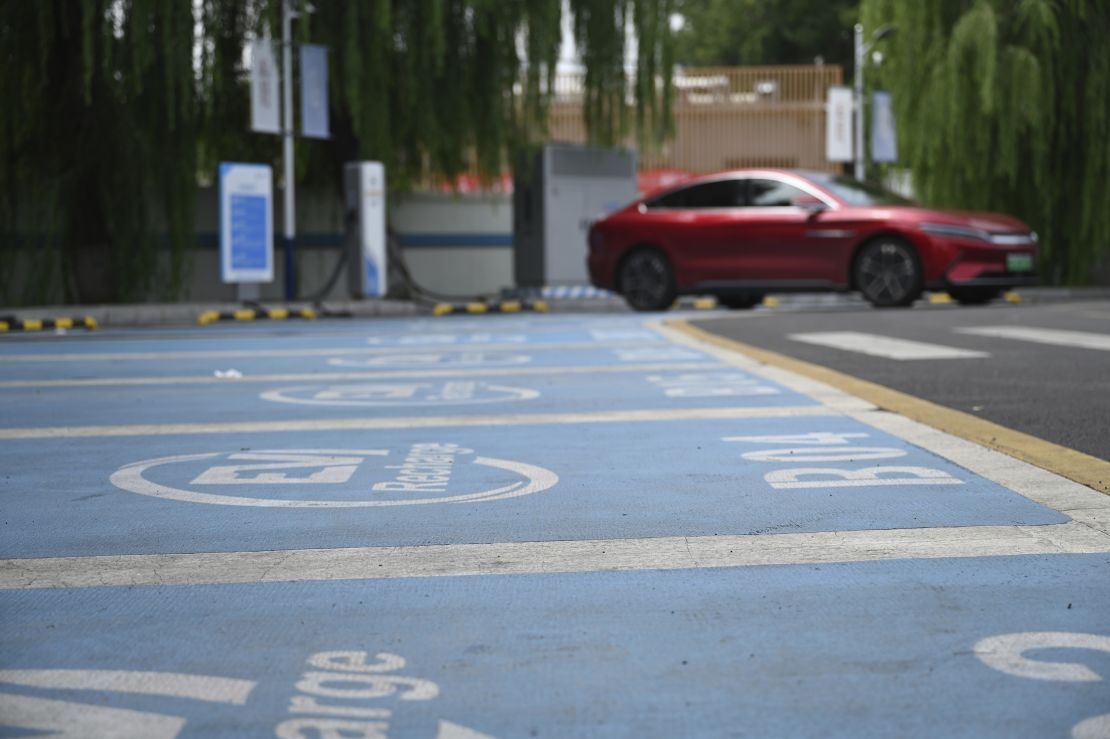 An electric car is parked at a charging station in Beijing on August 15, 2024.