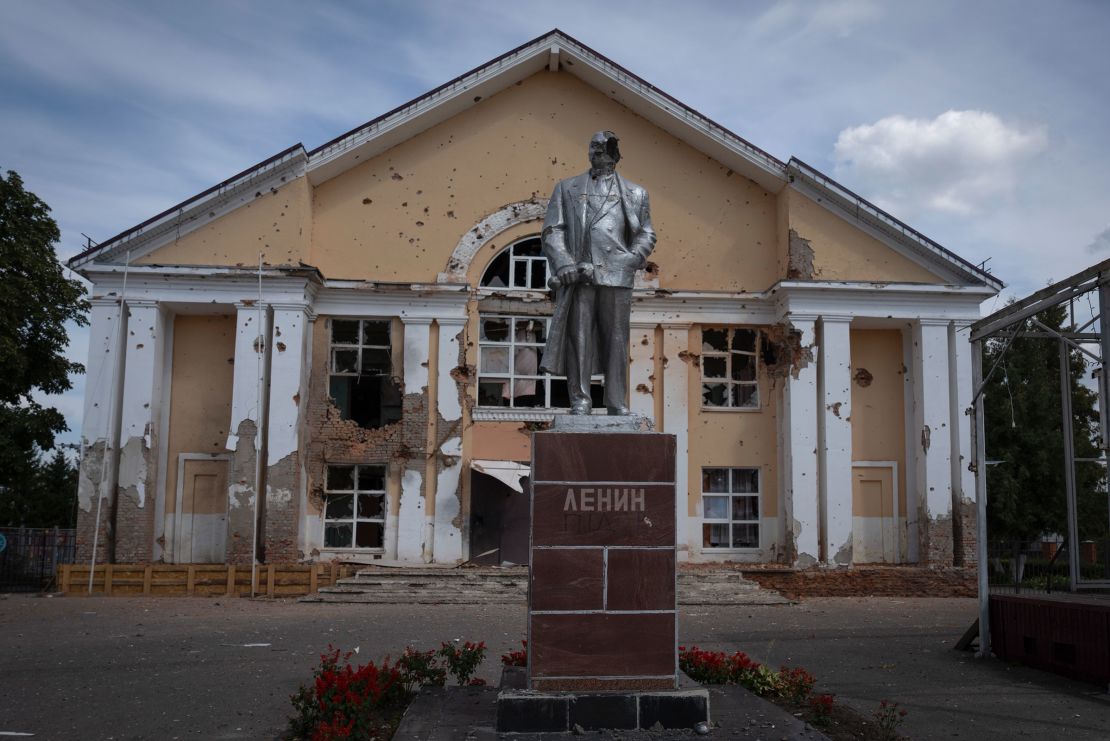 The statue of Lenin stands in front of a damaged building in Sudzha in August 2024.