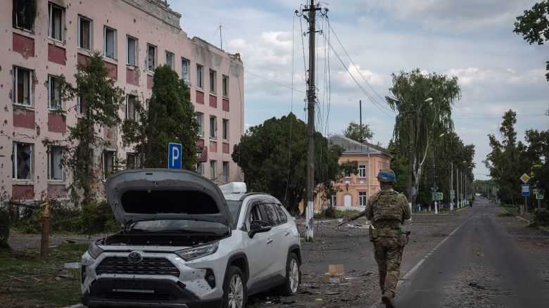 A Ukrainian soldier walks past at a city hall in Sudzha, Kursk region, Russia, Friday, Aug. 16, 2024.  This image was approved by the Ukrainian Defense Ministry before publication. (AP Photo)