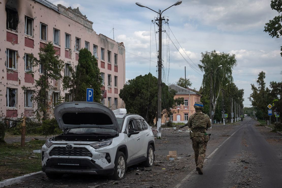 A Ukrainian soldier walks past at a city hall in Sudzha, Kursk region, Russia, Friday, Aug. 16, 2024. This image was approved by the Ukrainian Defense Ministry before publication.