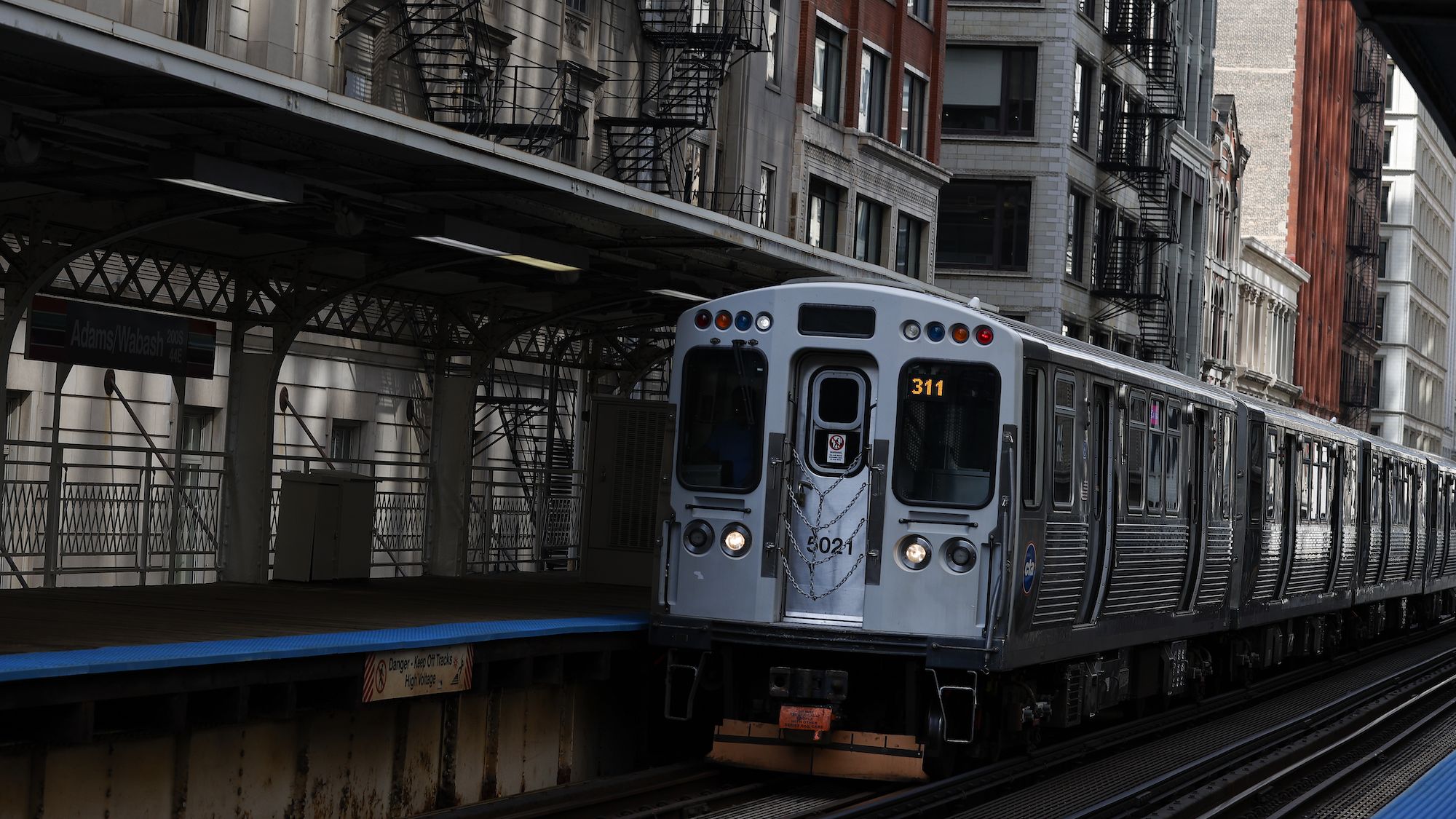 An elevated train moves along the tracks on August 16, 2024, in Chicago.