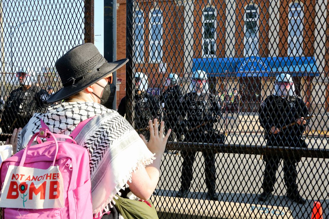 Riot police are on the scene after protestors from the first national March on the DNC broke down the fence barrier surrounding the perimeter of the United Center from Park 578, Chicago, IL on August 19, 2024.