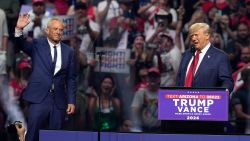 Independent presidential candidate Robert F. Kennedy Jr., left, waves to the crowd as Republican presidential nominee former President Donald Trump speaks at a campaign rally Friday, Aug. 23, 2024, in Glendale, Ariz. (AP Photo/Ross D. Franklin)