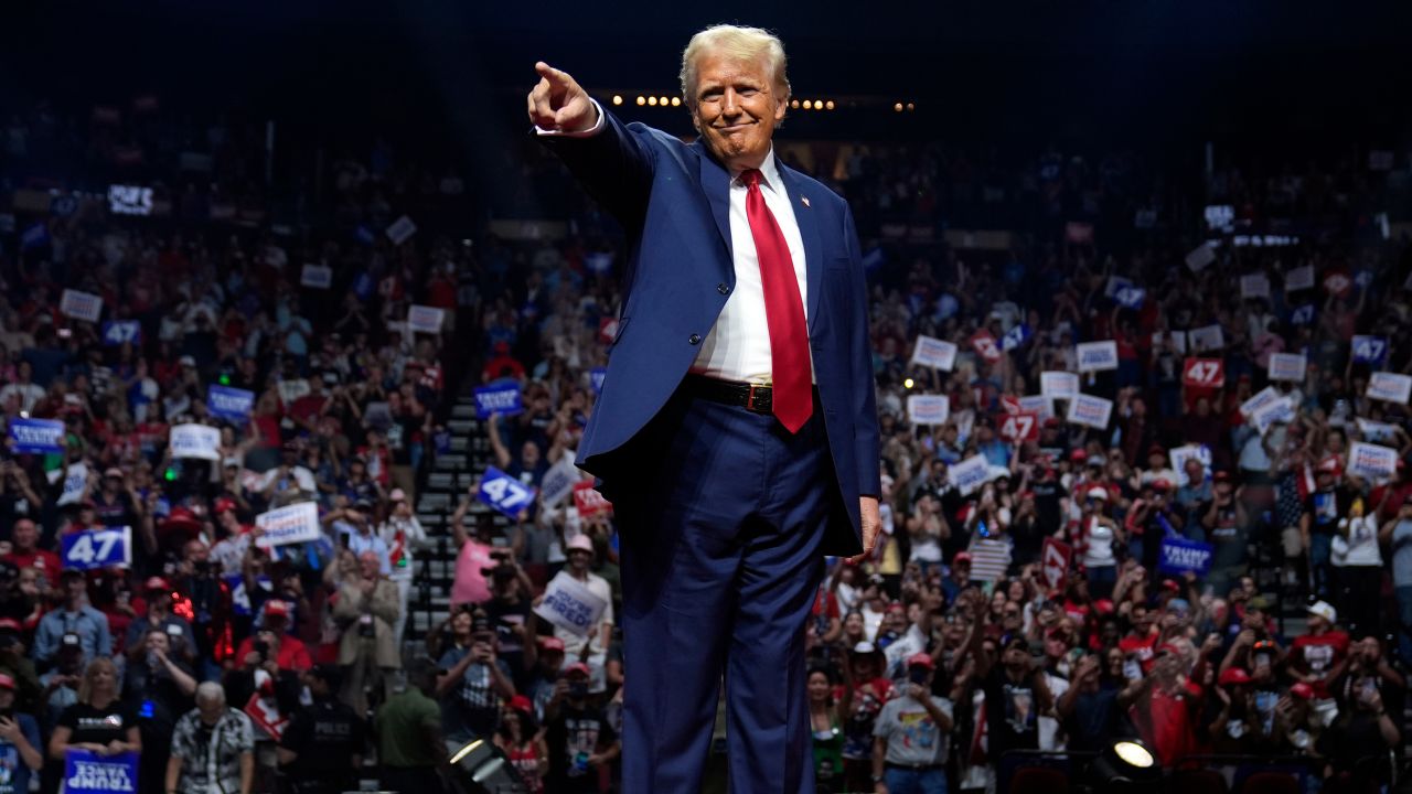 Republican presidential nominee former President Donald Trump points to supporters at a campaign rally at the Desert Diamond Arena, Friday, Aug. 23, 2024, in Glendale, Ariz.