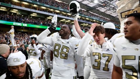 Georgia Tech Yellow Jackets players celebrate after upsetting the No. 10 Florida State Seminoles at Aviva Stadium in Dublin.