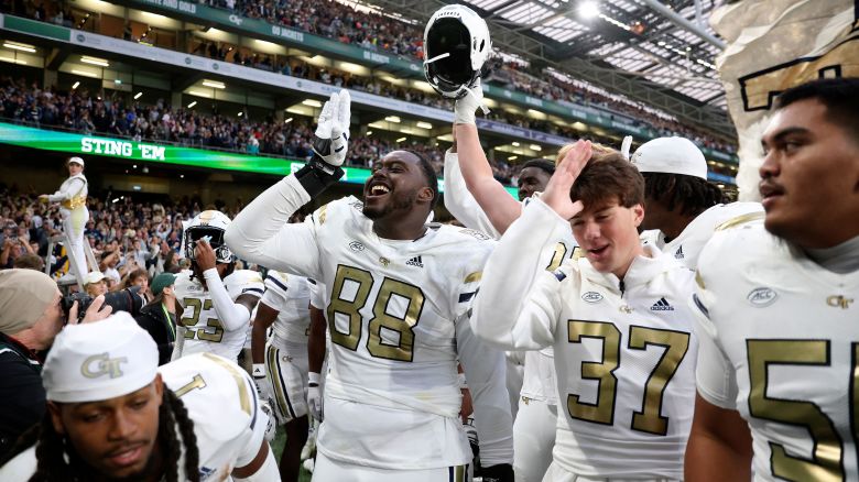 Georgia Tech Yellow Jackets players celebrate after upsetting the No. 10 Florida State Seminoles at Aviva Stadium in Dublin.