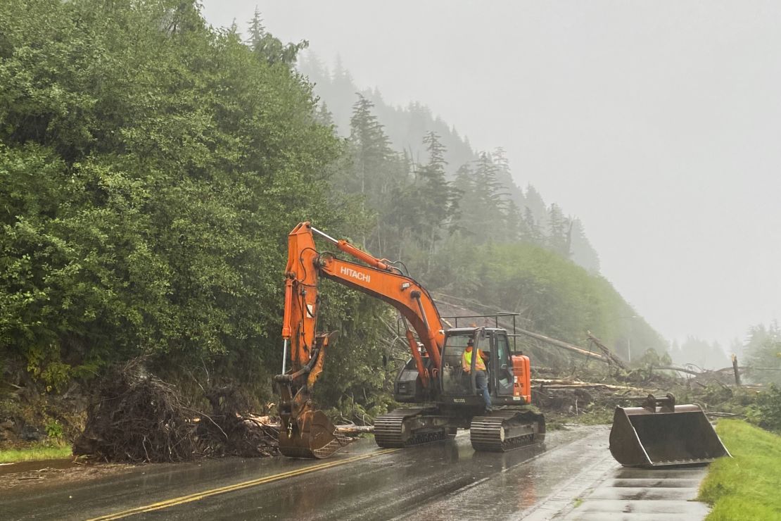 A worker clears debris after the landslide. (Anna Laffrey/Ketchikan Daily News via AP)