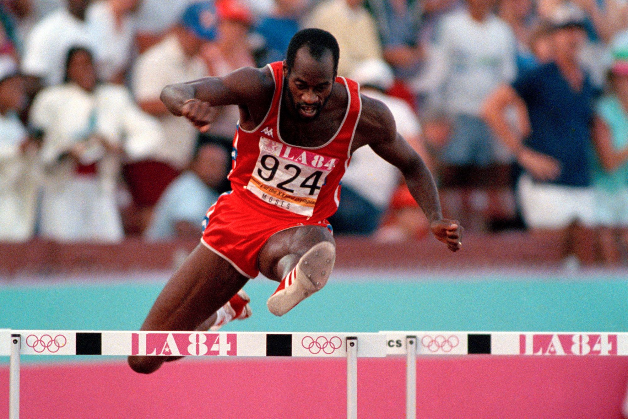 US' Edwin Moses jumps over a hurdle on his way to winning the gold medal in the 400-meter hurdles at the Summer Olympic Games in Los Angeles, August 5, 1984.