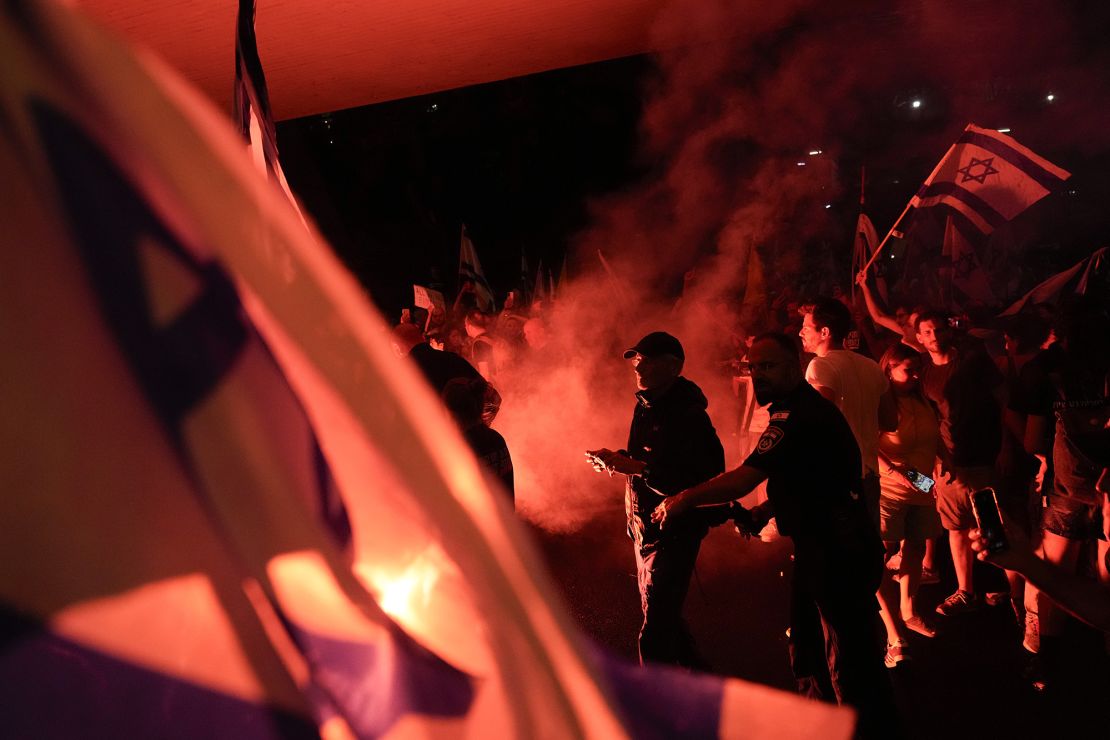 Protesters block a road in Tel Aviv on Sunday as they demand the release of hostages held in Gaza.