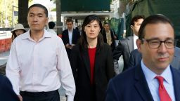 Attorney Seth DuCharme walks in front of former New York Governor Kathy Hochul aide Linda Sun, center, and her husband, Christopher Hu, left, leave Brooklyn Federal Court after their arraignment, Tuesday, Sept. 3, 2024, in New York. Sun is charged with being an aide to the Chinese government. (AP Photo/Corey Sipkin)