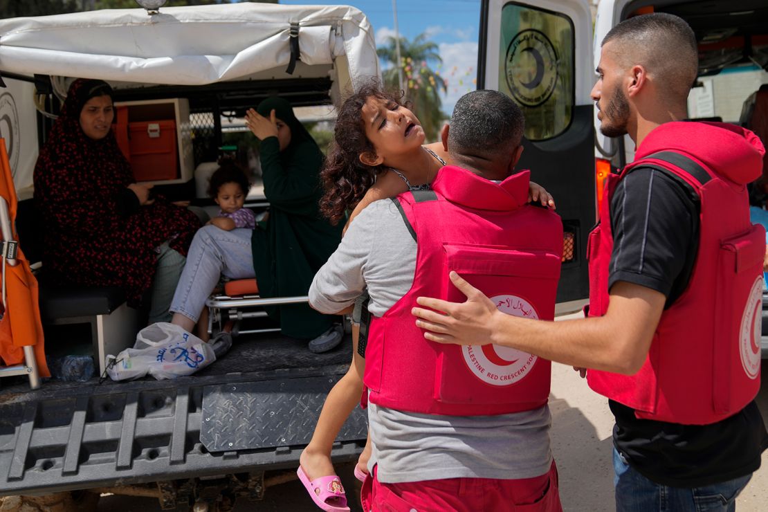 Palestinian paramedics help to evacuate residents during an Israeli military operation in Tulkarem, West Bank, on Wednesday.